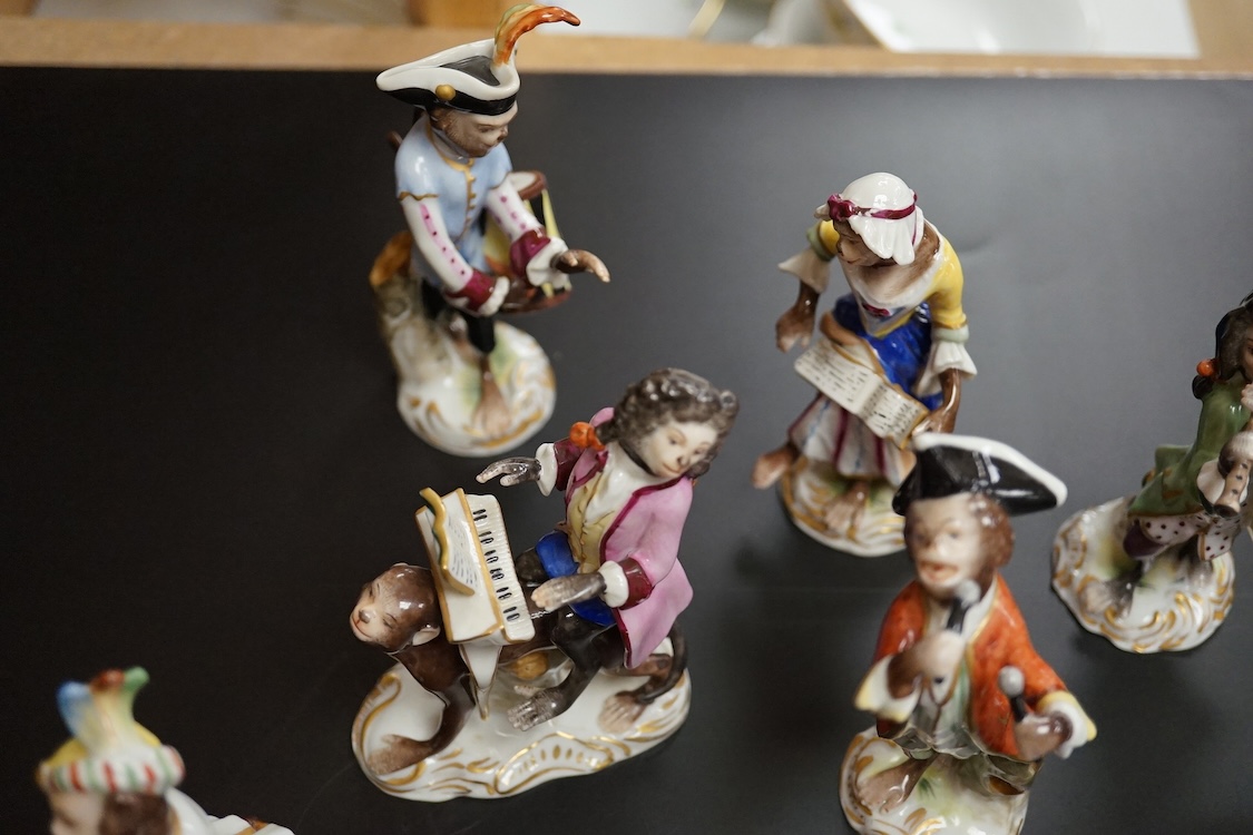A group of twenty German porcelain monkey band figures, largest 15.5cm high